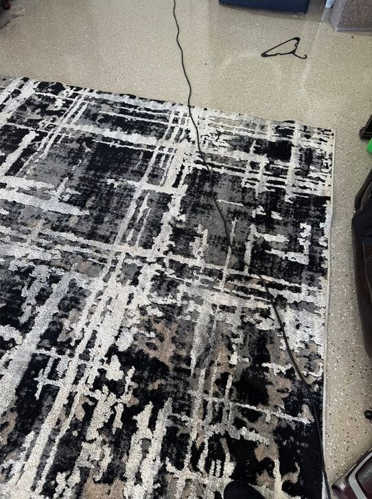 The same rug with its black and white pattern crisp again after cleaning