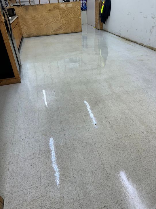 The same vinyl tile floor stripped and waxed to a high shine