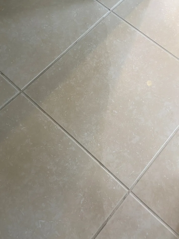 Tile floor with a dull film left behind by oil soap mopping