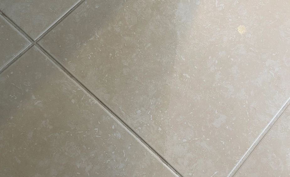Tile floor with a dull film left behind by oil soap mopping
